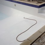 Swimming pool fully Fibreglassed and being filled ready for use.