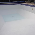 Swimming pool fully Fibreglassed and being filled ready for use.